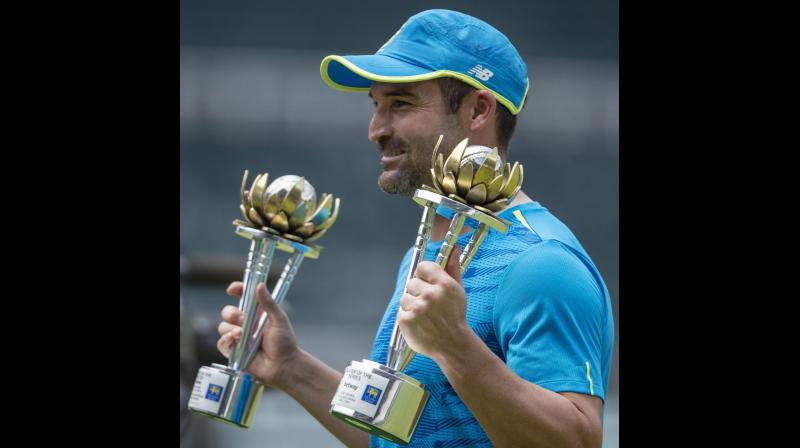 South Africa’s Dean Elgar holds the “Man of the Match and the Series” trophies at the end of play on the third day of the second cricket Test match between South Africa and Sri Lanka at Wanderers stadium in Johannesburg, South Africa, on Tuesday. - AP . South Africa’s Dean Elgar holds the “Man of the Match and the Series” trophies at the end of play on the third day of the second cricket Test match between South Africa and Sri Lanka at Wanderers stadium in Johannesburg, South Africa, on Tuesday. - AP .