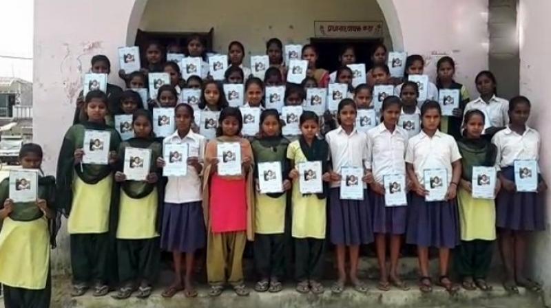 Pakistani girl's photo features on an Indian booklet's cover page Pakistani girl's photo features on an Indian booklet's cover page