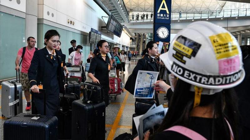 More than 100 flights were cancelled in Hong Kong on Monday morning with airport authorities warning passengers of potential disruption, as pro-democracy protesters kick off a city-wide strike. (Photo: AFP) More than 100 flights were cancelled in Hong Kong on Monday morning with airport authorities warning passengers of potential disruption, as pro-democracy protesters kick off a city-wide strike. (Photo: AFP)