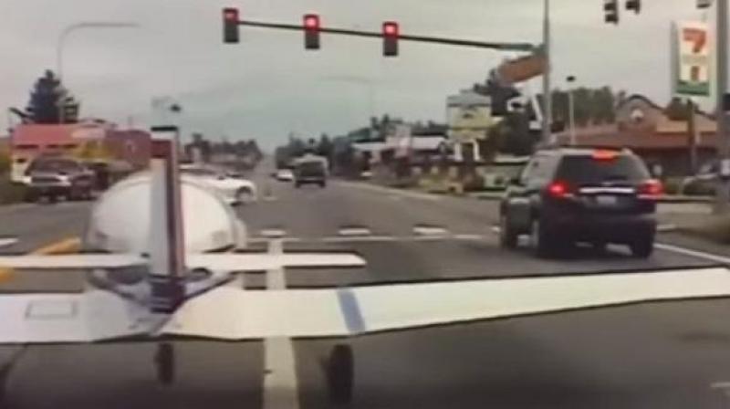 A small plane was landed on a busy stretch of road in Washington on Thursday, shocking commuters. (Photo: AP/ video screengrab) A small plane was landed on a busy stretch of road in Washington on Thursday, shocking commuters. (Photo: AP/ video screengrab)