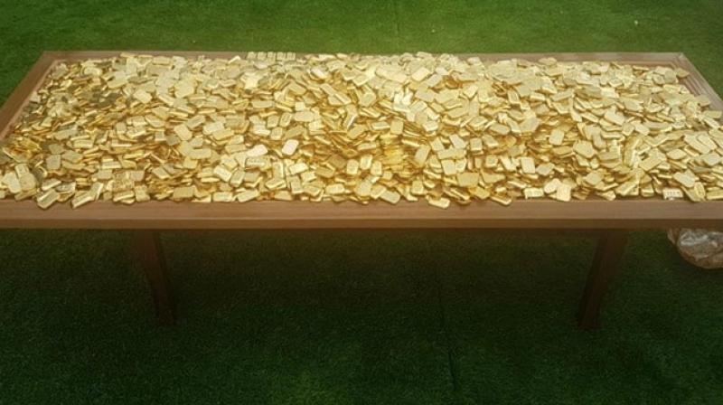 The Special Investigation Team (SIT) probing the multi-crore IMA group ponzi scam on Wednesday seized 303 kg of fake gold bars hidden under the swimming pool in the sixth floor of a building in Bengaluru belonging to group owner Mohammed Mansoor Khan. (Photo: Twitter/ ANI) The Special Investigation Team (SIT) probing the multi-crore IMA group ponzi scam on Wednesday seized 303 kg of fake gold bars hidden under the swimming pool in the sixth floor of a building in Bengaluru belonging to group owner Mohammed Mansoor Khan. (Photo: Twitter/ ANI)