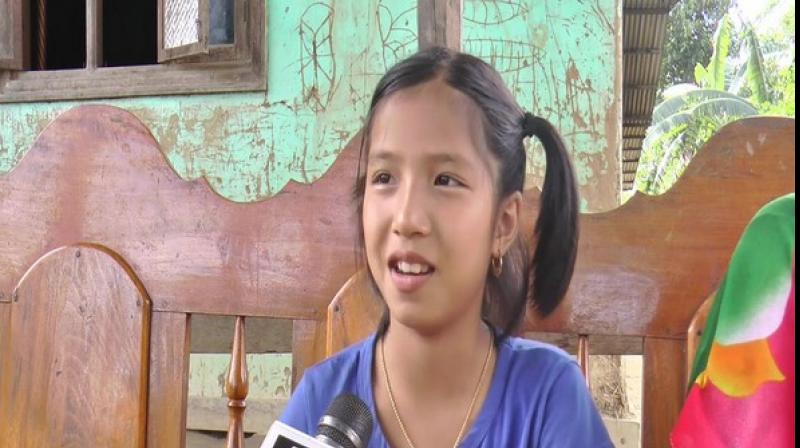 Valentina Elangbam, a 9-year-old from Hiyanglam Makha Leikai in Kakching district has been made the ambassador of "Chief Minister's Green Manipur Mission" after a video of her crying over axing of trees, that she had planted, went viral. (Photo: ANI) Valentina Elangbam, a 9-year-old from Hiyanglam Makha Leikai in Kakching district has been made the ambassador of "Chief Minister's Green Manipur Mission" after a video of her crying over axing of trees, that she had planted, went viral. (Photo: ANI)