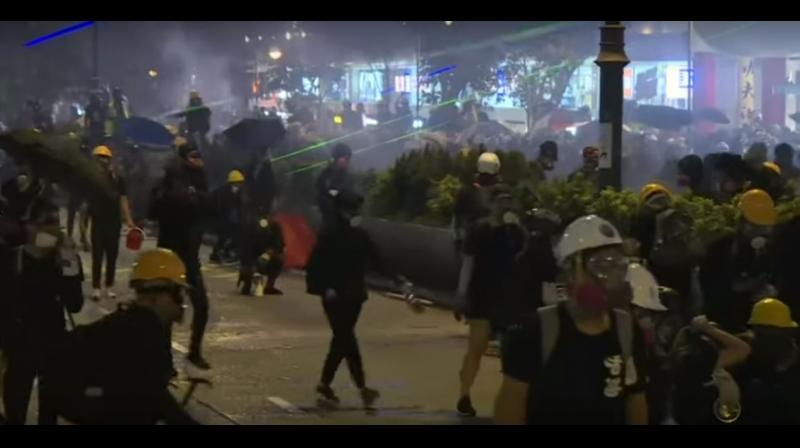 Hong Kong police fired volleys of tear gas to disperse anti-government protesters on Saturday - sending tourists fleeing weeping in Kowloon - only for demonstrators to regroup and gather elsewhere during another tense, hot and restive weekend. (Photo: AFP/ video screengrab) Hong Kong police fired volleys of tear gas to disperse anti-government protesters on Saturday - sending tourists fleeing weeping in Kowloon - only for demonstrators to regroup and gather elsewhere during another tense, hot and restive weekend. (Photo: AFP/ video screengrab)