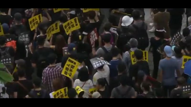 Hundreds of thousands of protesters carrying umbrellas poured across the heart of Hong Kong island defying torrential rain and a police order not to march from a park where they had gathered earlier for a rally. (Photo: AFP/ video screengrab) Hundreds of thousands of protesters carrying umbrellas poured across the heart of Hong Kong island defying torrential rain and a police order not to march from a park where they had gathered earlier for a rally. (Photo: AFP/ video screengrab)