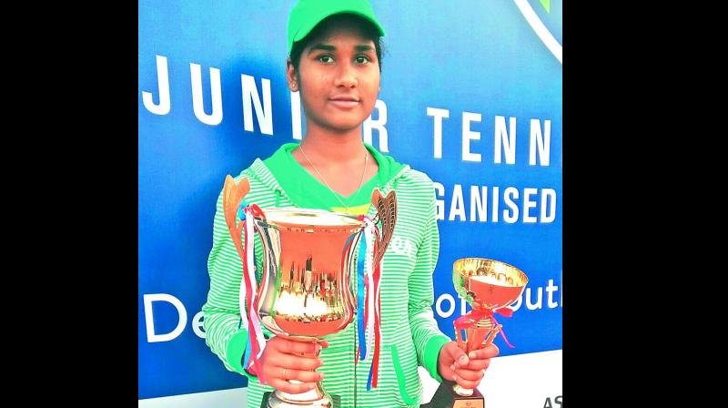 Telangana girl Sunskrithi Damera poses with her trophies from the All-India Tennis Super Series Championship played recently in Kolkata. Sunskrithi won the girls U-14 singles and finished runner-up in the U-16 singles and U-16 doubles categories. Telangana girl Sunskrithi Damera poses with her trophies from the All-India Tennis Super Series Championship played recently in Kolkata. Sunskrithi won the girls U-14 singles and finished runner-up in the U-16 singles and U-16 doubles categories.