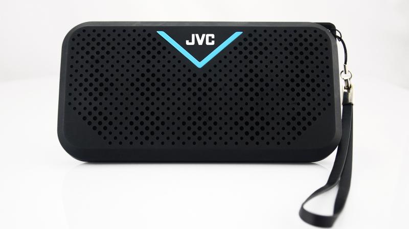 The speaker comes with a holder at the back of the unit for standing devices. The speaker comes with a holder at the back of the unit for standing devices.