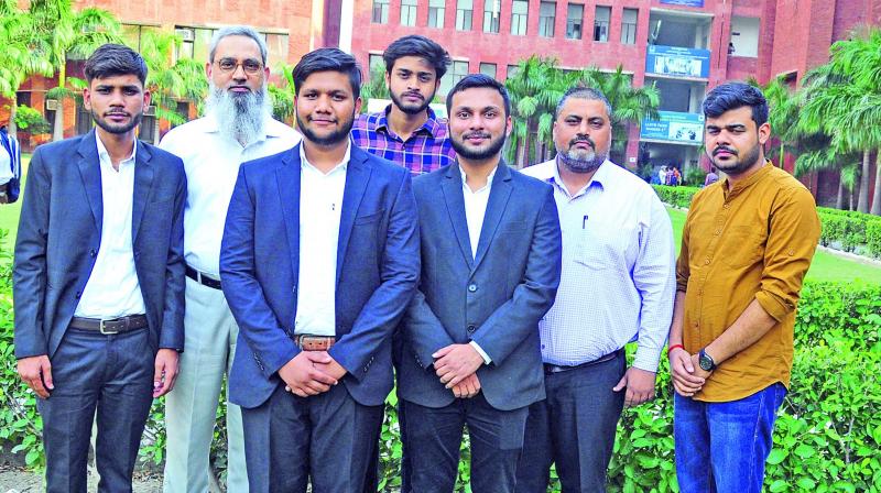 L–R: Amit Yadav, Dr. Md. Salim (Director, Lloyd Law College), Aman Banka, Rishav Rajan, Amrendra Kumar Singh, Akhilesh Kumar Khan (Deputy Director), and Vaibhav Shahi; these are some of the people who have assisted or supported Rishav with his petition (Photo: Bunny Smith) L–R: Amit Yadav, Dr. Md. Salim (Director, Lloyd Law College), Aman Banka, Rishav Rajan, Amrendra Kumar Singh, Akhilesh Kumar Khan (Deputy Director), and Vaibhav Shahi; these are some of the people who have assisted or supported Rishav with his petition (Photo: Bunny Smith)