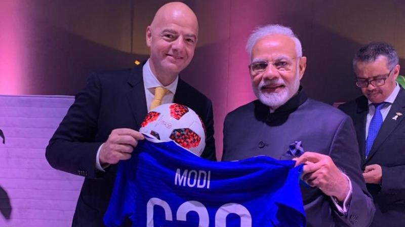 Modi, who met Infantino on the sidelines of the G-20 Summit in Buenos Aires on Saturday, shared a picture of the blue jersey, with his name on the back, on Twitter. (Photo: Twitter) Modi, who met Infantino on the sidelines of the G-20 Summit in Buenos Aires on Saturday, shared a picture of the blue jersey, with his name on the back, on Twitter. (Photo: Twitter)