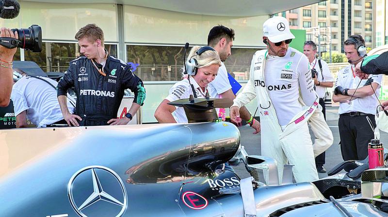 Mercedes’ Lewis Hamilton stands next to his car during a red flag session at the Azerbaijan Grand Prix in Baku. (Photo: AP) Mercedes’ Lewis Hamilton stands next to his car during a red flag session at the Azerbaijan Grand Prix in Baku. (Photo: AP)