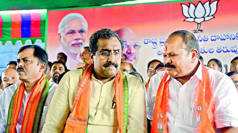 BJP state president Kanna Lakshminarayana interacts with National general secretary Ram Madhav at the dharna in Vijayawada on Monday. (DC) BJP state president Kanna Lakshminarayana interacts with National general secretary Ram Madhav at the dharna in Vijayawada on Monday. (DC)