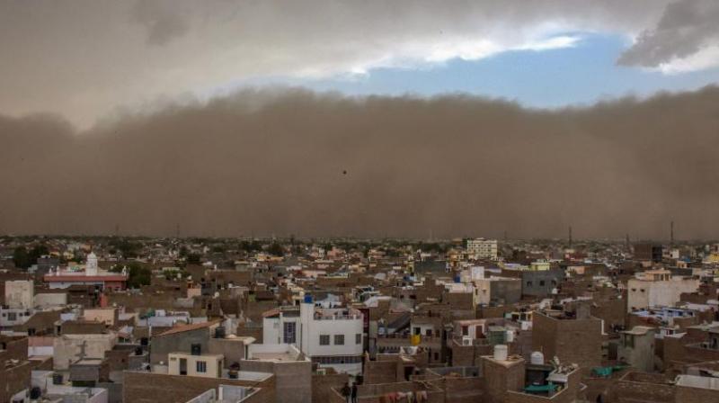 The dust storm caused major destruction in Alwar where more than 100 trees were uprooted, many of which fell on stationary vehicles and snapped electricity cables. (Photo: PTI) The dust storm caused major destruction in Alwar where more than 100 trees were uprooted, many of which fell on stationary vehicles and snapped electricity cables. (Photo: PTI)