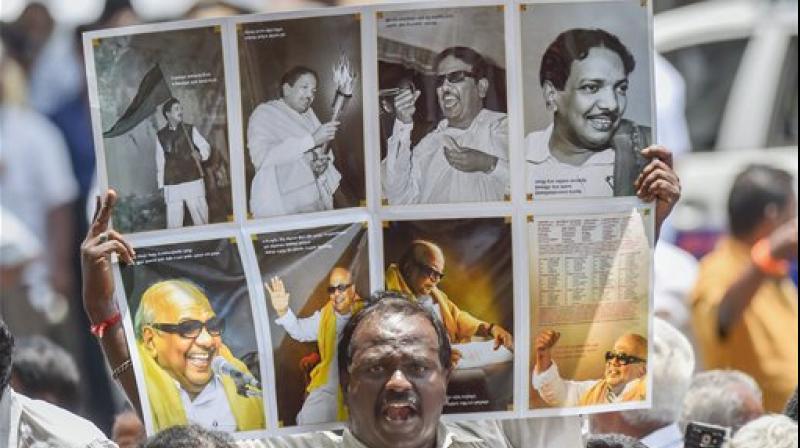 DMK supporters raise a placard outside the hospital where DMK chief M Karunanidhi is being treated for fever due to urinary tract infection, in Chennai. (Photo: PTI) DMK supporters raise a placard outside the hospital where DMK chief M Karunanidhi is being treated for fever due to urinary tract infection, in Chennai. (Photo: PTI)