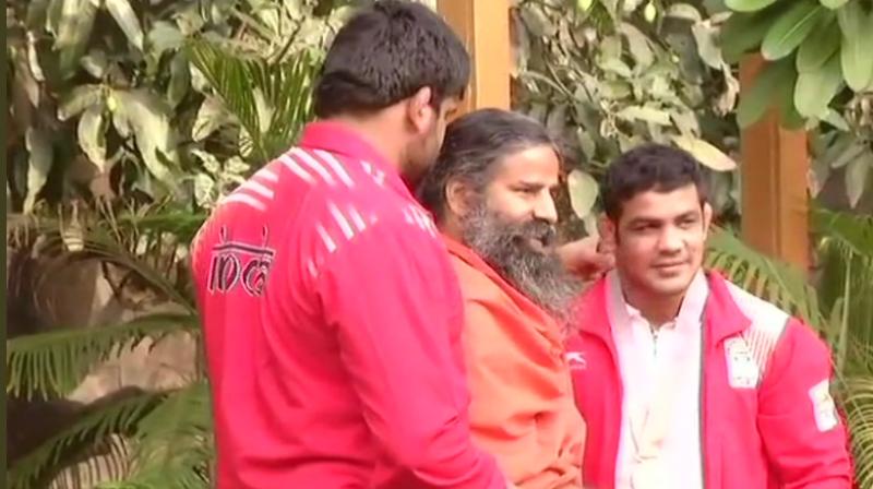 Ramdev heaped praise on two-time Olympic medallist Sushil Kumar after he bagged a gold medal in 2018 Gold Coast Commonwealth Games. (Photo: ANI) Ramdev heaped praise on two-time Olympic medallist Sushil Kumar after he bagged a gold medal in 2018 Gold Coast Commonwealth Games. (Photo: ANI)