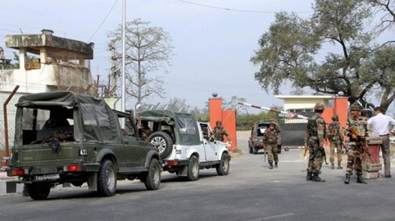Security personnel take positions during a gun battle with suspected militants at Army camp at Nagrota near Jammu on Tuesday. (Photo: PTI) Security personnel take positions during a gun battle with suspected militants at Army camp at Nagrota near Jammu on Tuesday. (Photo: PTI)