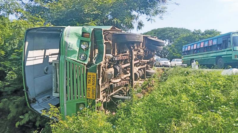 The overturned MTC bus near Madurantakam. (Photo: DC) The overturned MTC bus near Madurantakam. (Photo: DC)