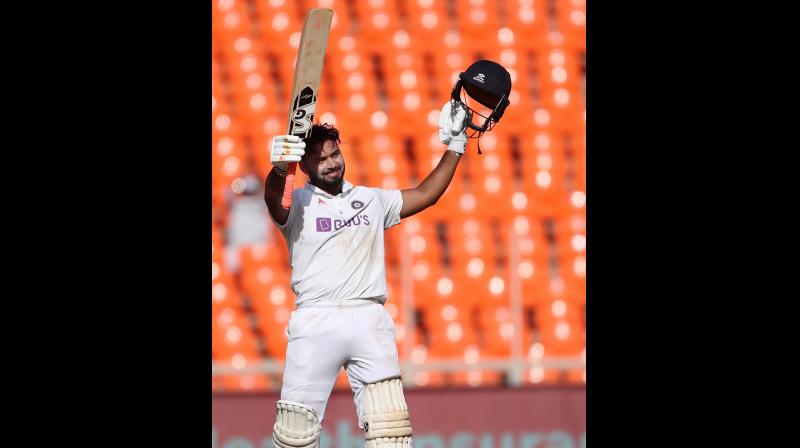 Indias Rishabh Pant celebrates his century against England during the second day of the fourth Test at the Narendra Modi Stadium in Ahmedabad on Friday. 	 PTI