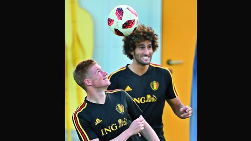 Kevin De Bruyne (left) of Belgium heads the ball next to teammate Marouane Fellaini during a training session. (Photo: AFP) Kevin De Bruyne (left) of Belgium heads the ball next to teammate Marouane Fellaini during a training session. (Photo: AFP)