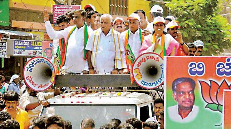 A file photo of State BJP president B.S. Yeddyurappa and party candidate Srinivasprasad campaigning in Nanjangud. A file photo of State BJP president B.S. Yeddyurappa and party candidate Srinivasprasad campaigning in Nanjangud.