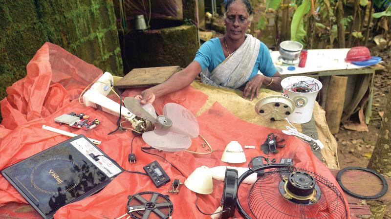 A woman cleans household items in her house at Kannadikal in Kozhikode. (Photo: VENUGOPAL) A woman cleans household items in her house at Kannadikal in Kozhikode. (Photo: VENUGOPAL)
