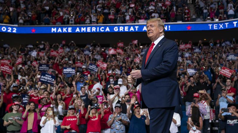 President Donald Trump arrives on stage to speak at a campaign rally at the BOK Center in Tulsa, Okla. (AP File photo)