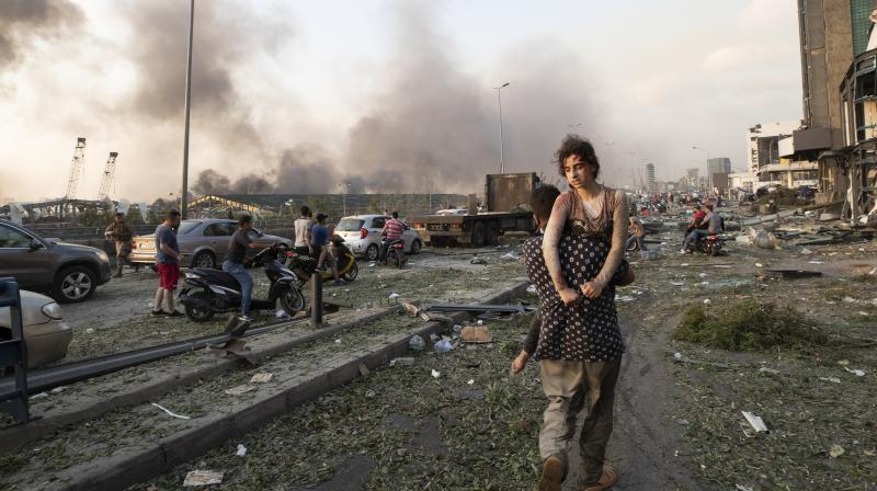 People evacuate the wounded after a massive explosion in Beirut, Lebanon, Tuesday, Aug. 4, 2020. (AP)