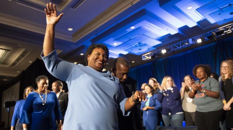 Georgia Democratic gubernatorial candidate Stacey Abrams leaves the stage after addressing supporters during an election night watch party in Atlanta.(AP)