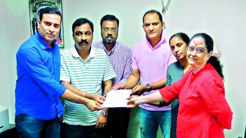 Members of the Cricket Players Association of Hyderabad’s steering committee VVS Laxman (left), Md Azharuddin (third from right), Rajani Venugopal (second from right) and Vidya Yadav (right) pose as they hand over names of selectors and coaching staff to Hyderabad Cricket Association secretary T. Sheshnarayan (second from left) and joint secretary Ajmal Asad at the Gymkhana grounds on Tuesday. Members of the Cricket Players Association of Hyderabad’s steering committee VVS Laxman (left), Md Azharuddin (third from right), Rajani Venugopal (second from right) and Vidya Yadav (right) pose as they hand over names of selectors and coaching staff to Hyderabad Cricket Association secretary T. Sheshnarayan (second from left) and joint secretary Ajmal Asad at the Gymkhana grounds on Tuesday.