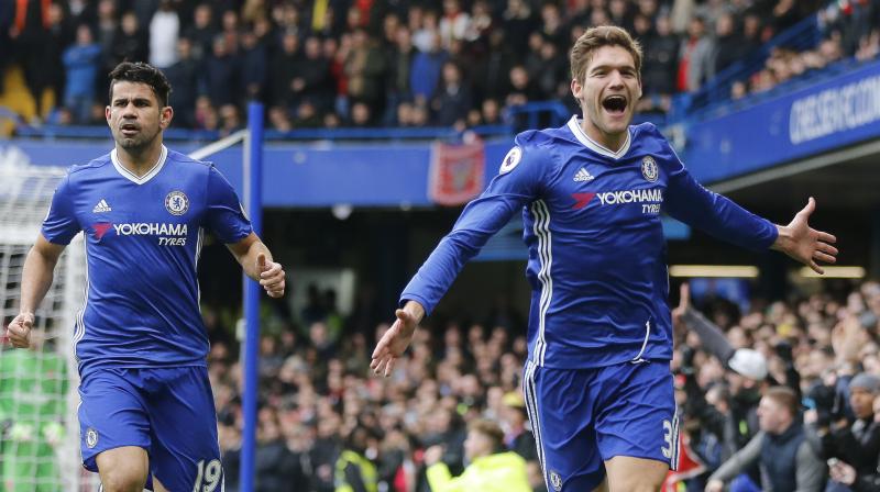 Chelsea's Marcos Alonso (R) celebrates after scoring against Arsenal. (Photo: AP) Chelsea's Marcos Alonso (R) celebrates after scoring against Arsenal. (Photo: AP)