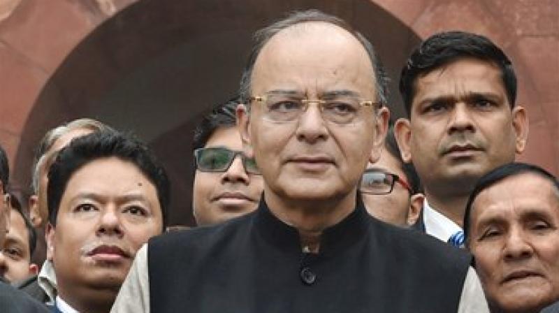 Finance Minister Arun Jaitley stands outside the North Block with the briefcase containing Union Budget for 2017 to be announced on Wednesday. (Photo: PTI) Finance Minister Arun Jaitley stands outside the North Block with the briefcase containing Union Budget for 2017 to be announced on Wednesday. (Photo: PTI)