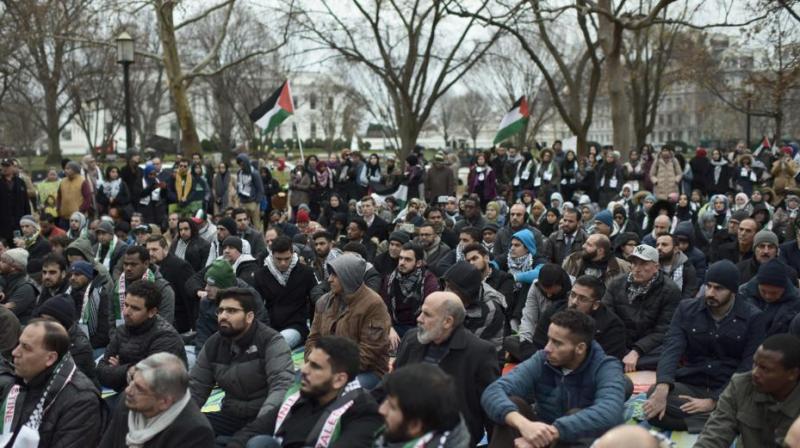 Wearing traditional Palestinian keffiyeh scarves or the colours of the Palestinian flag, protesters also held placards denouncing Israeli occupation of East Jerusalem and the West Bank. (Photo: AFP) Wearing traditional Palestinian keffiyeh scarves or the colours of the Palestinian flag, protesters also held placards denouncing Israeli occupation of East Jerusalem and the West Bank. (Photo: AFP)