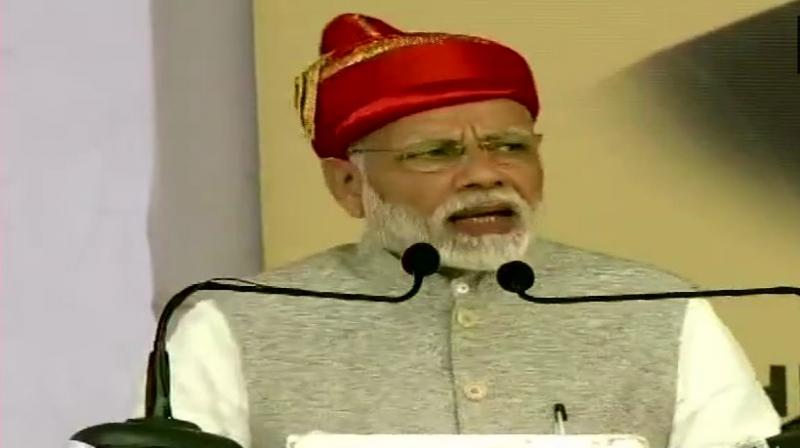 PM Modi launched four-laning of Solapur-Osmanabad section of NH-211, underground sewerage system and three sewage treatment plants and laid the foundation stone of 30,000 houses under Pradhan Mantri Awas Yojana. (Photo: ANI | Twitter) PM Modi launched four-laning of Solapur-Osmanabad section of NH-211, underground sewerage system and three sewage treatment plants and laid the foundation stone of 30,000 houses under Pradhan Mantri Awas Yojana. (Photo: ANI | Twitter)