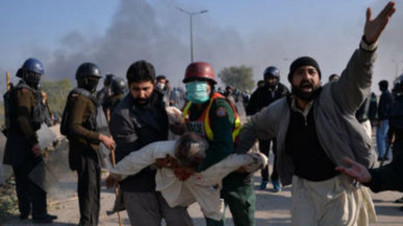 Security forces fired tear gas and rubber bullets and demonstrators blocked roads and burned police vehicles around the site of the sit-in. (Photo: AFP) Security forces fired tear gas and rubber bullets and demonstrators blocked roads and burned police vehicles around the site of the sit-in. (Photo: AFP)