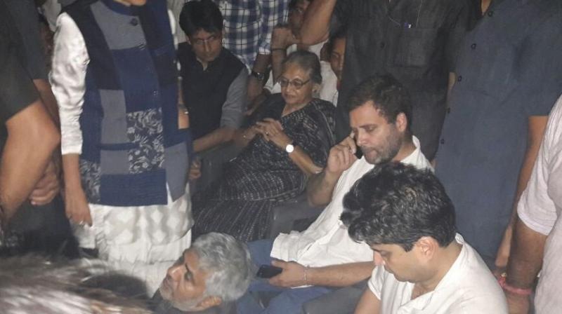 Congress Vice President Rahul Gandhi with other Congress leaders in police station. (Photo: ANI Twitter) Congress Vice President Rahul Gandhi with other Congress leaders in police station. (Photo: ANI Twitter)