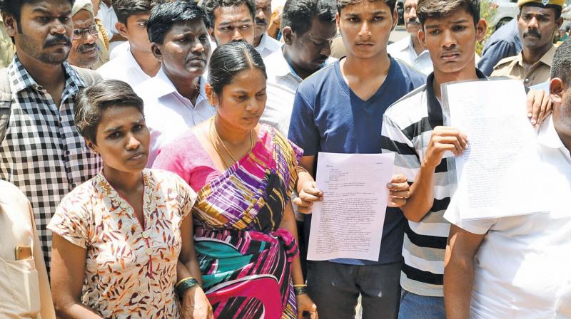 Palanisamy’s wife and son. Palanisamy’s wife and son.