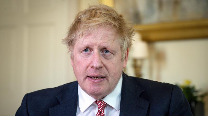 Handout image released by 10 Downing Street shows Britains prime minister Boris Johnson as he delivers a television address after returning to 10 Downing Street after being discharged from St Thomas Hospital, in central London on April 12, 2020. Johnson was discharged from hospital on Sunday, a week after being admitted for treatment for coronavirus and spending three days in intensive care. \The PM has been discharged from hospital to continue his recovery, at Chequers,\ the spokesman said, referring to the prime ministers country estate outside London. (Photo by Pippa FOWLES / 10 Downing Street / AFP) / RESTRICTED TO EDITORIAL USE - MANDATORY CREDIT \AFP PHOTO / 10 DOWNING STREET / PIPPA FOWLES\ - NO MARKETING - NO ADVERTISING CAMPAIGNS - DISTRIBUTED AS A SERVICE TO CLIENTS