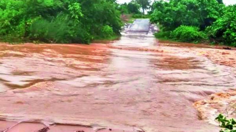 Isukavagu at Gondigudem in Aswapuram in Bhadradri district is in spate and a person T. Narsimha Rao washed away while crossing the river on Wednesday. (DC) Isukavagu at Gondigudem in Aswapuram in Bhadradri district is in spate and a person T. Narsimha Rao washed away while crossing the river on Wednesday. (DC)