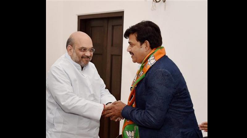 Actor Ravi Kishan with BJP chief Amit Shah (Photo: PTI) Actor Ravi Kishan with BJP chief Amit Shah (Photo: PTI)