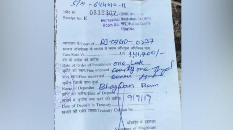 The truck, having a Rajasthan registration number, was caught by the enforcement team on Thursday, the transport department official. (Photo: ANI) The truck, having a Rajasthan registration number, was caught by the enforcement team on Thursday, the transport department official. (Photo: ANI)