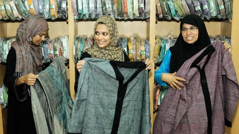 Women check out purdahs displayed at Khadi showroom at Cherootty Road. (Photo: VENUGOPAL) Women check out purdahs displayed at Khadi showroom at Cherootty Road. (Photo: VENUGOPAL)