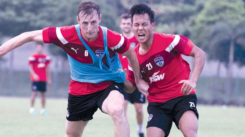 Bengaluru FC defender John Johnson (left) and Udanta Singh vie for the ball at a training session in Cuttack on Saturday, the eve of their Federation Cup final against Mohun Bagan. Bengaluru FC defender John Johnson (left) and Udanta Singh vie for the ball at a training session in Cuttack on Saturday, the eve of their Federation Cup final against Mohun Bagan.