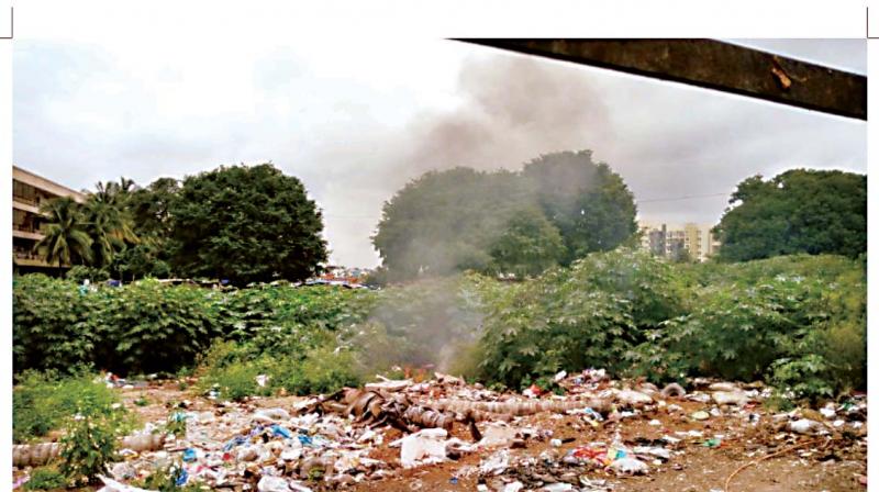 Garbage being burnt at Yelachenahalli. Garbage being burnt at Yelachenahalli.