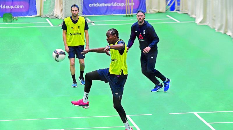 Jofra Archer (centre) plays football during a training session of the England team at the Old Trafford Cricket Ground in Manchester on Monday, eve of their match against Afghanistan. (Photo: AFP) Jofra Archer (centre) plays football during a training session of the England team at the Old Trafford Cricket Ground in Manchester on Monday, eve of their match against Afghanistan. (Photo: AFP)