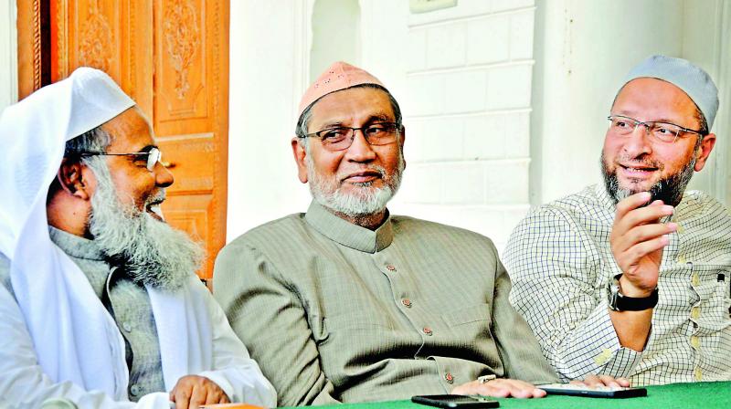 All India Muslim Personal Law Board general secretary Maulana Khalid Saifullah Rahmani along with MIM chief along with Hyderabad MP Asaduddin Owasi (right) and a member of board Akbar Nizamuddin (centre) address the media on the issue of triple talaq at Darussalam, in the city on Thursday. (Image: P. Surendra) All India Muslim Personal Law Board general secretary Maulana Khalid Saifullah Rahmani along with MIM chief along with Hyderabad MP Asaduddin Owasi (right) and a member of board Akbar Nizamuddin (centre) address the media on the issue of triple talaq at Darussalam, in the city on Thursday. (Image: P. Surendra)
