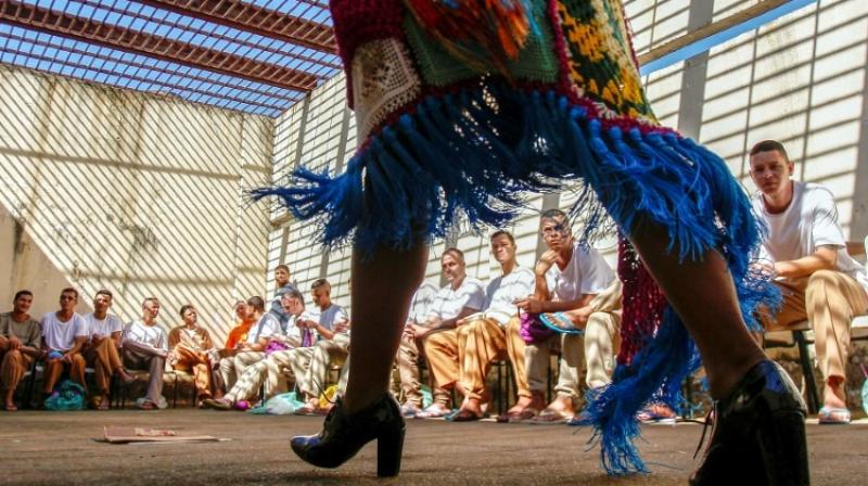 Silvestre has taken the project twice to Sao Paulo Fashion Week, with some former inmates even modeling the crochet creations in front of the who's who of Latin American fashion. (Photo: AFP) Silvestre has taken the project twice to Sao Paulo Fashion Week, with some former inmates even modeling the crochet creations in front of the who's who of Latin American fashion. (Photo: AFP)