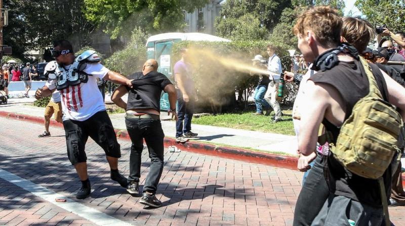 Joey Gibson (black t-shirt), leader of the alt-right Patriot Prayer group, gets pepper sprayed by leftist counter demonstrators in Berkeley, California. (Photo: AFP) Joey Gibson (black t-shirt), leader of the alt-right Patriot Prayer group, gets pepper sprayed by leftist counter demonstrators in Berkeley, California. (Photo: AFP)