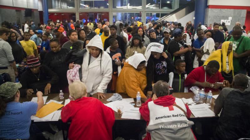 Thousands take shelter from the Tropical Storm Harvey at the George R. Brown Convention Center in Houston. (Photo: AP) Thousands take shelter from the Tropical Storm Harvey at the George R. Brown Convention Center in Houston. (Photo: AP)