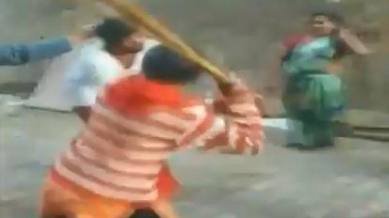 The video shows women beating up the priest who, in a white kurta and with bare legs, tries to defend self. (Photo: Twitter | Screengrab) The video shows women beating up the priest who, in a white kurta and with bare legs, tries to defend self. (Photo: Twitter | Screengrab)