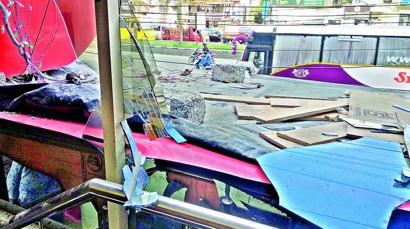 Shattered glass and a broken window are seen at Shah Ghouse restaurant following a blast caused by gas leakage on Friday. Shattered glass and a broken window are seen at Shah Ghouse restaurant following a blast caused by gas leakage on Friday.