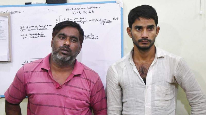 Haneef Khan and Nazeem Akbar, accused of ATM robbery, brought by police to the interrogation centre at Tripunithura Haneef Khan and Nazeem Akbar, accused of ATM robbery, brought by police to the interrogation centre at Tripunithura