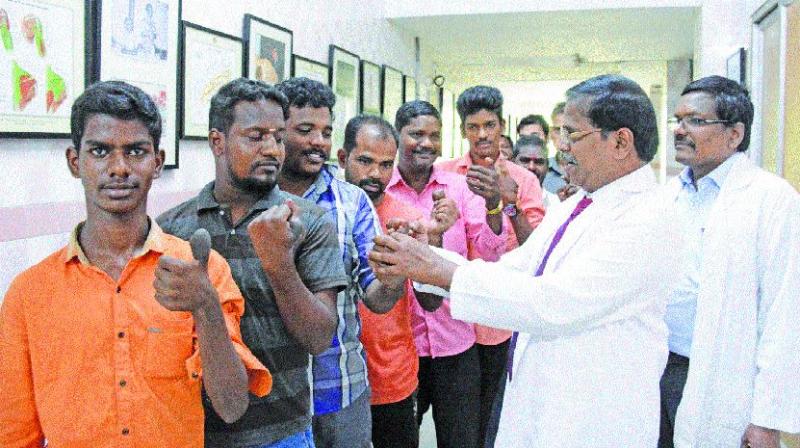 Dr K. Boopathi, HoD, plastic surgery department, Government Stanley Hospital, examines after successful surgery of their thumbs on Friday. (Photo: DC) Dr K. Boopathi, HoD, plastic surgery department, Government Stanley Hospital, examines after successful surgery of their thumbs on Friday. (Photo: DC)